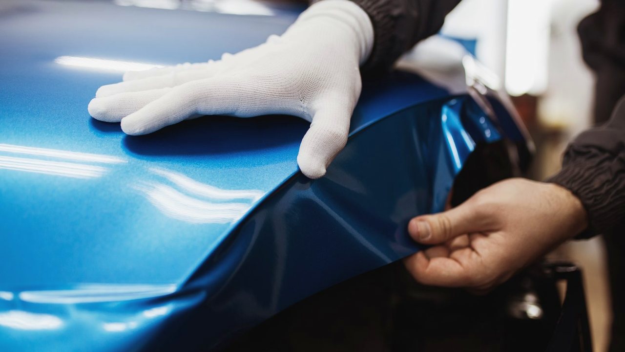 Level blue vinyl color-change wrap with a clean gloss finish